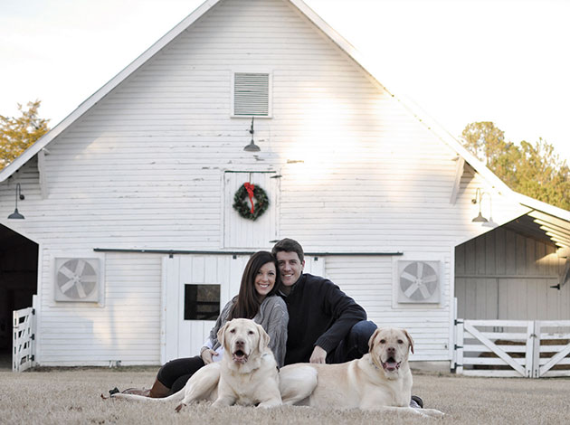 Tew family with dogs at a barn.